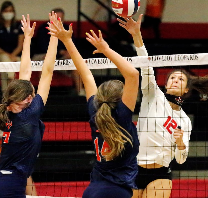 Lovejoy High School middle hitter Hannah Gonzalez (12) makes a hit during game two as...