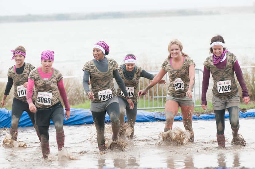 Women competing in the Dirty Girl Mud Run at Cedar Hill State Park on Saturday, Oct. 6,...