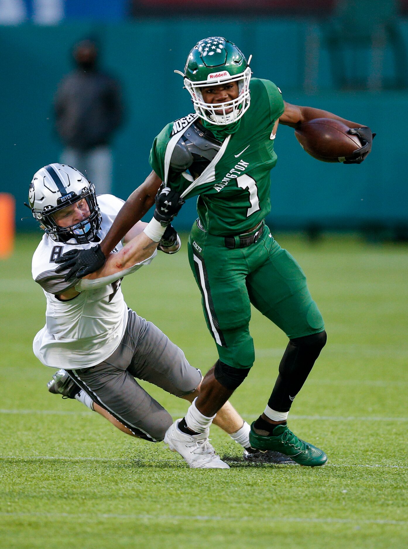 Denton Guyer senior fullback Logan Mcdurmon (8) tackles Arlington sophomore wide receiver...