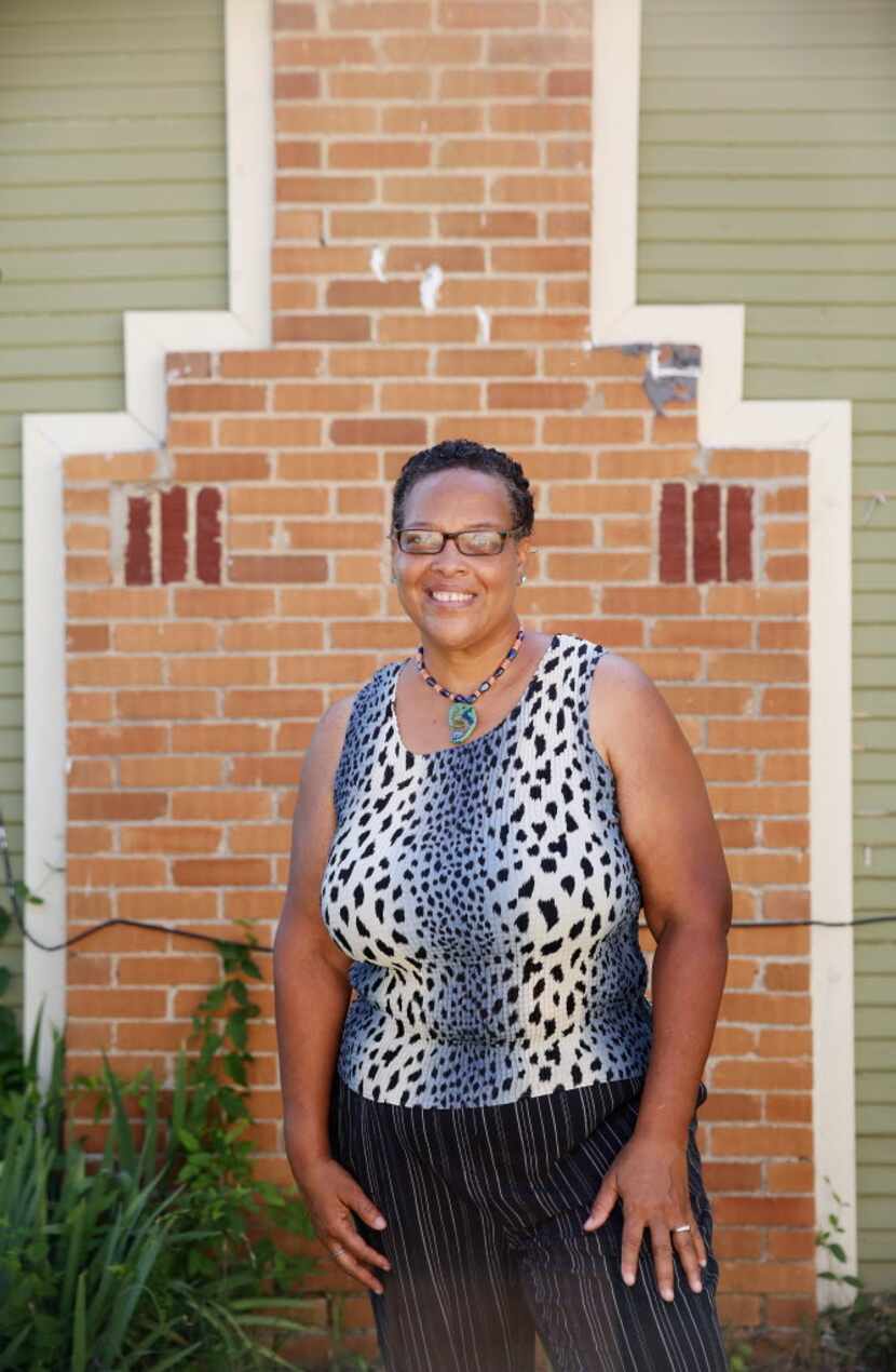 Lou Nell Sims stands for a portrait outside her house  along 11th Street on the east side of...