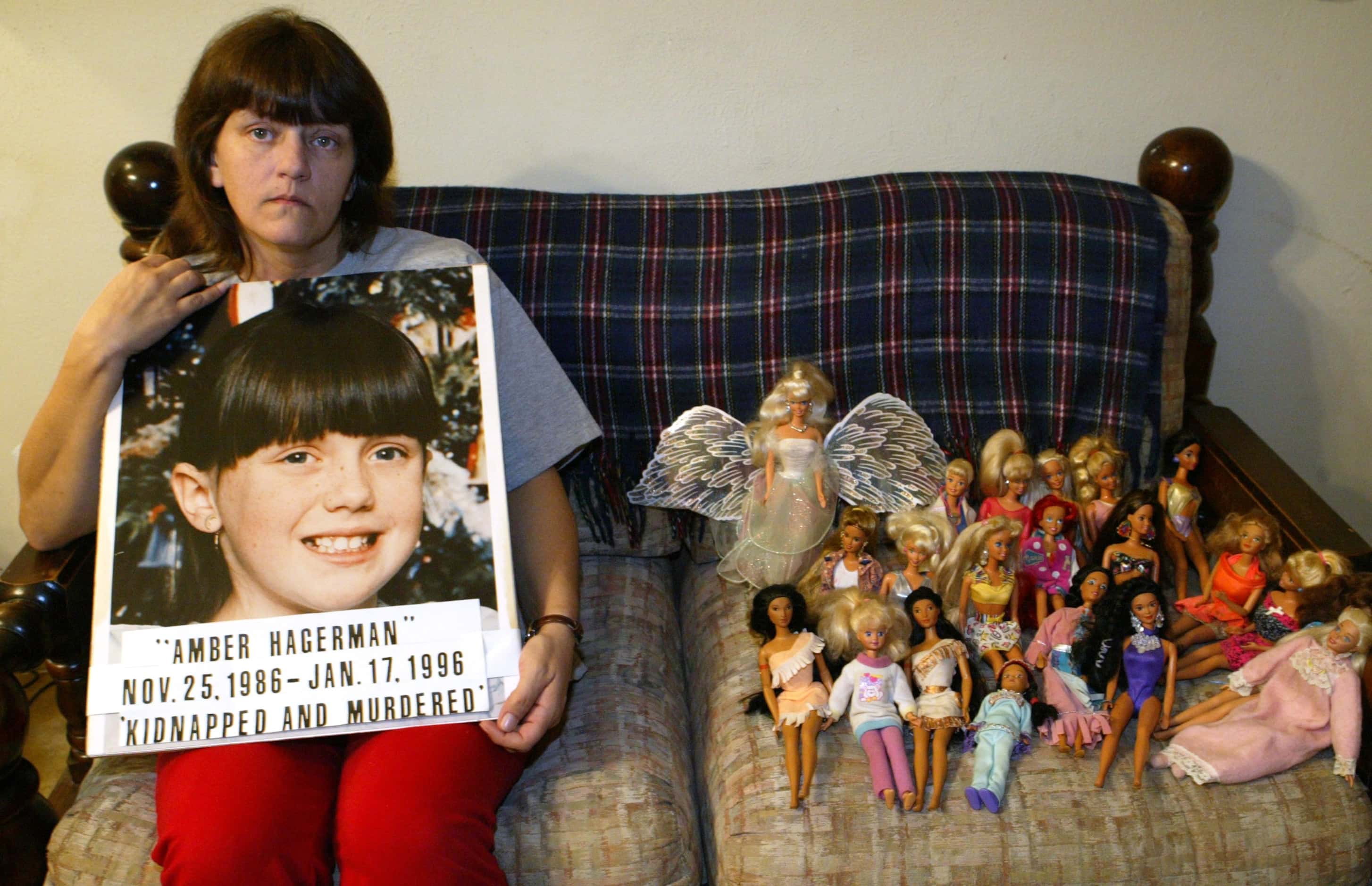 Donna Norris, mother of Amber Hagerman, sits next to her daughter's dolls while at her home...