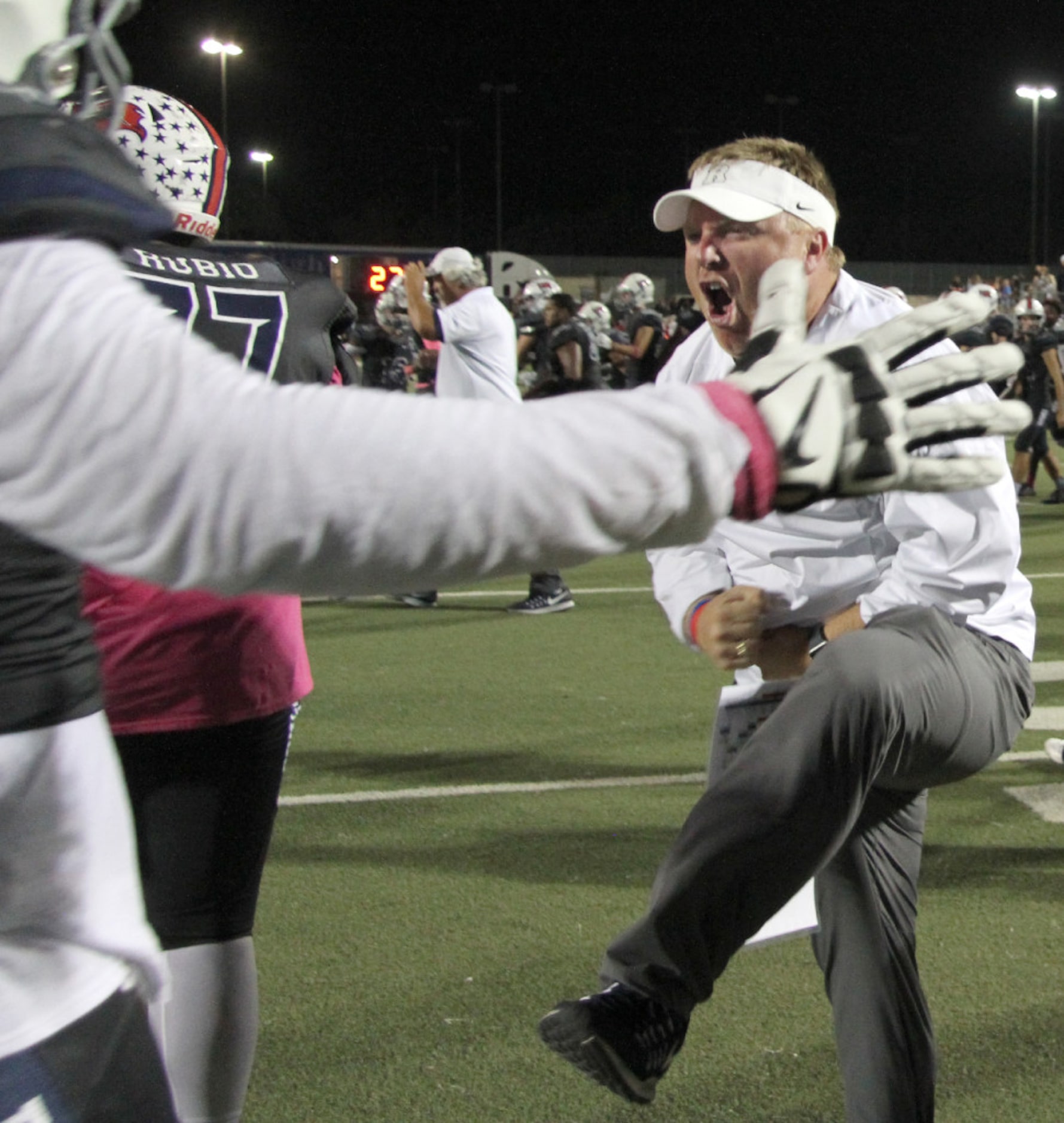 Richland offensive coordinator Daniel Oelschlegel celebrates with members of his offensive...