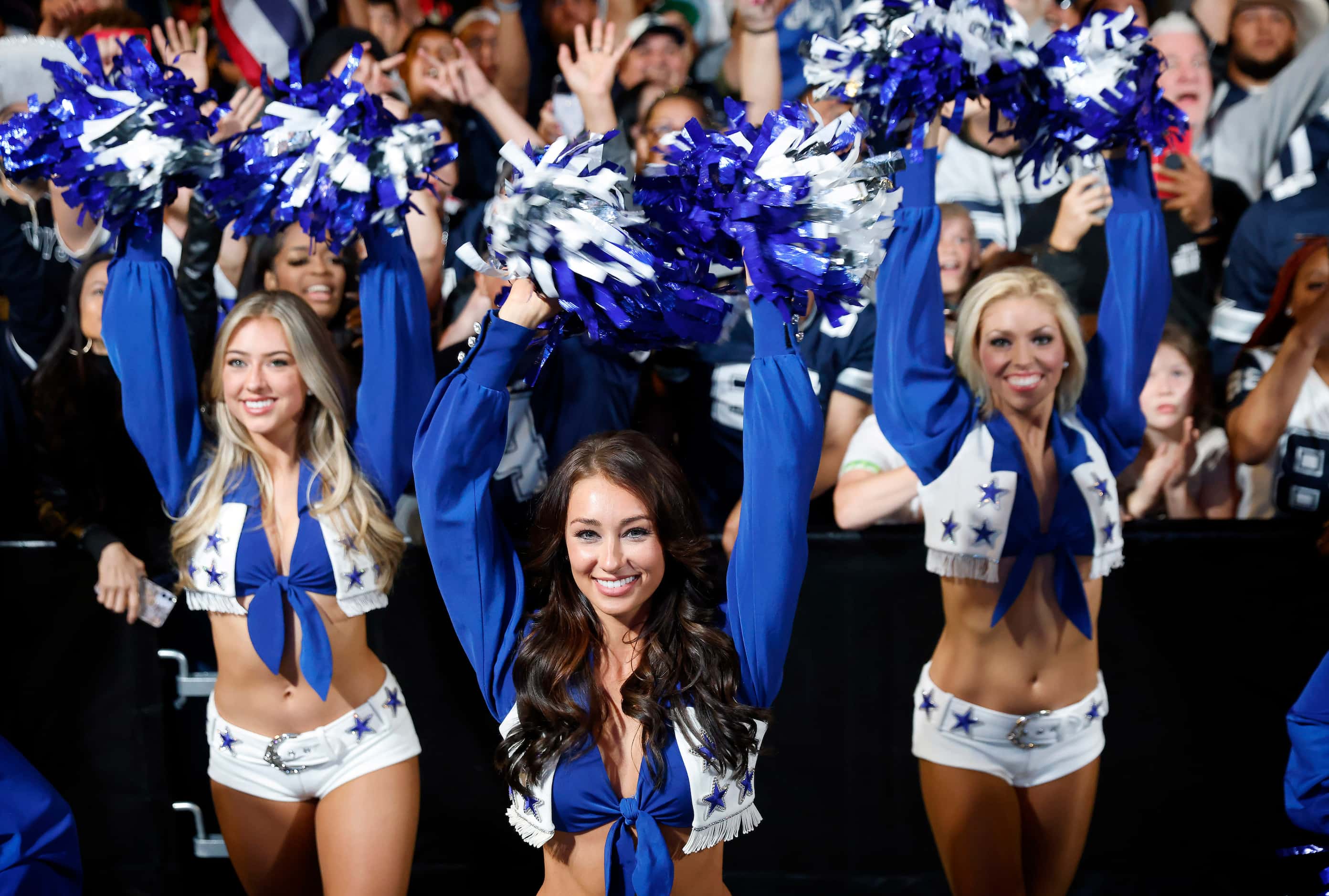 Dallas Cowboys Cheerleaders perform for fans before the 26th pick in the NFL Draft during a...
