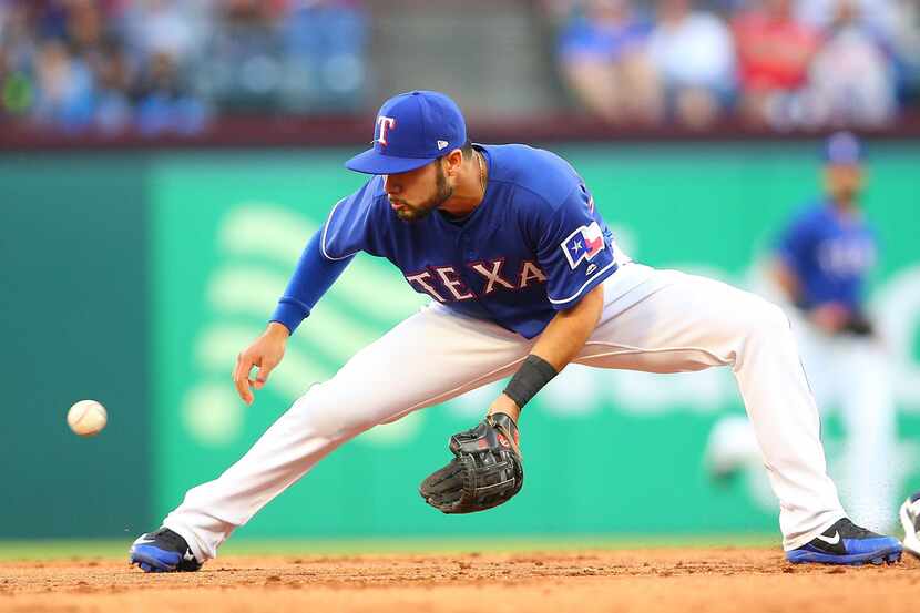 ARLINGTON, TX - APRIL 20: Isiah Kiner-Falefa #9 of the Texas Rangers misses the tag on...