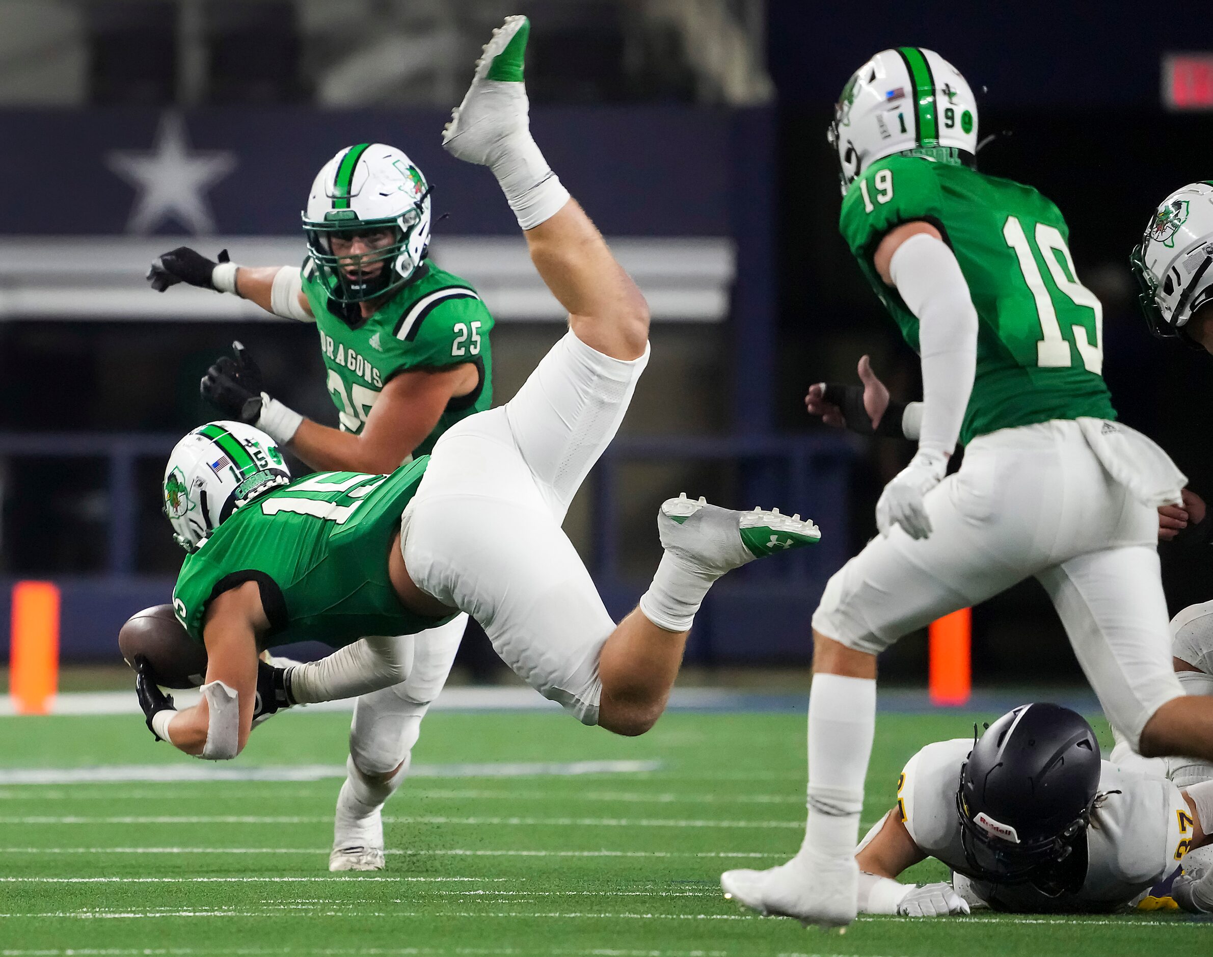 Southlake Carroll linebacker Allan Kleiman (15) makes a leaping interception on a pass...