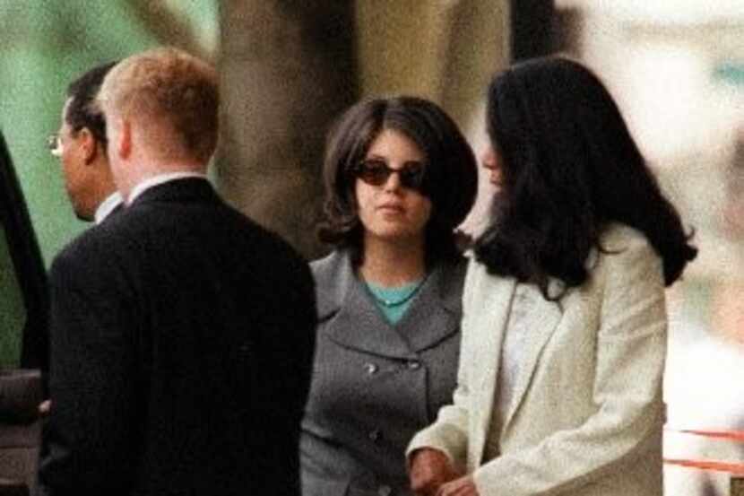  Monica Lewinsky (center) left federal court with Judy Smith in Washington inÂ 1998 after...