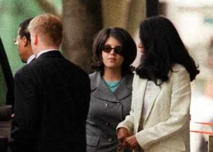  Monica Lewinsky (center) left federal court with Judy Smith in Washington inÂ 1998 after...
