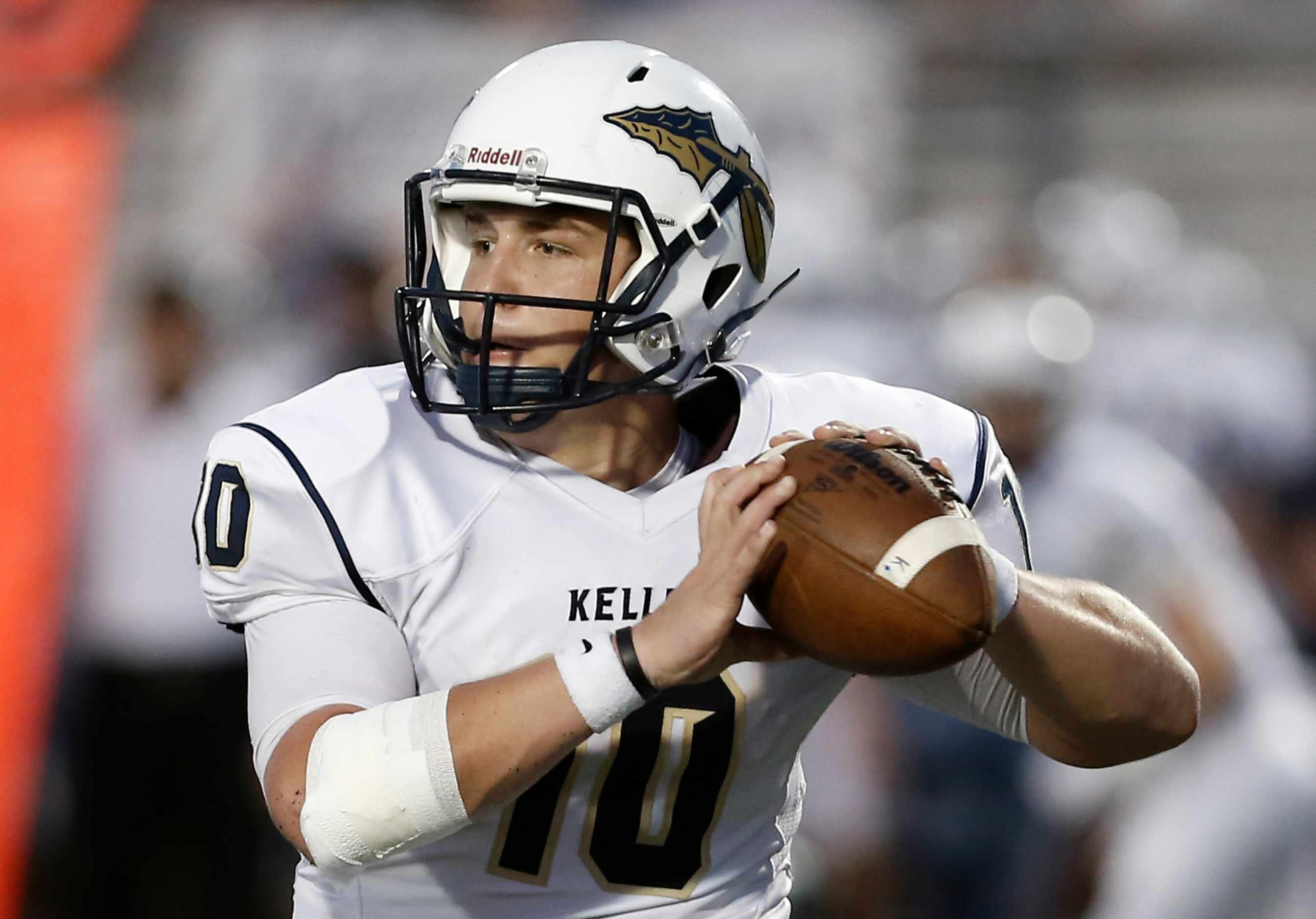 Keller senior quarterback Caleb Griffin (10) looks to pass during the first half of a high...
