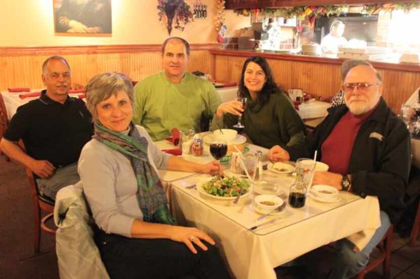 
Artur Pira (center) is surrounded by longtime Richardson customers Lois and Richard Ferrara...