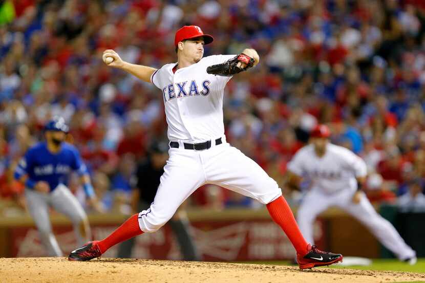 Texas Rangers relief pitcher Chi Chi Gonzalez (21) throws during the sixth inning of their...