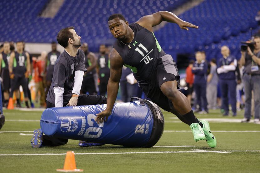 UCLA defensive lineman Kenny Clark runs a drill at the NFL football scouting combine in...