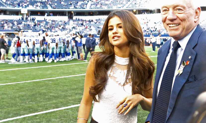 Selena Gomez, shown with Dallas Cowboys owner Jerry Jones, performed during halftime of the...