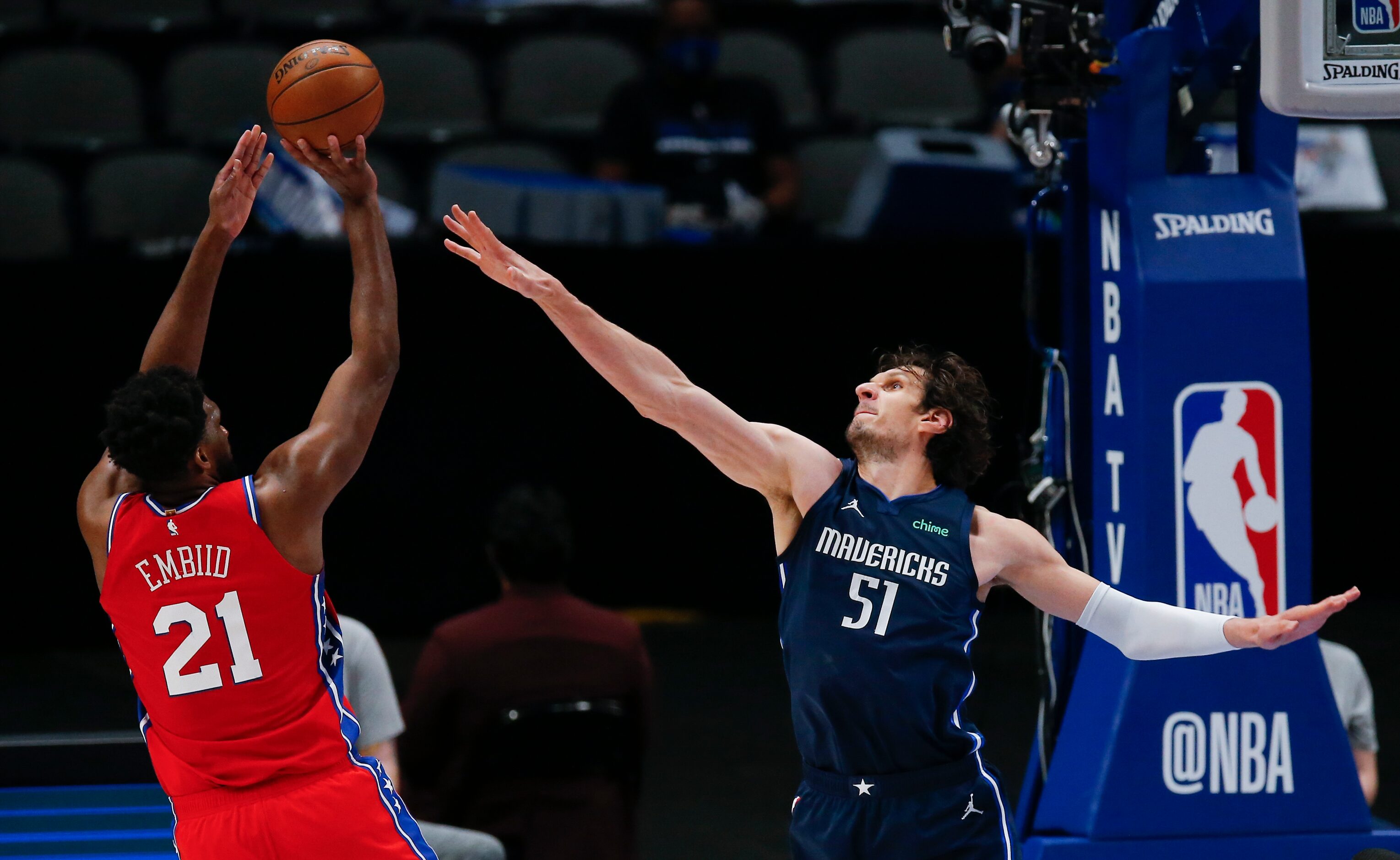 Philadelphia 76ers forward Joel Embiid (21) attempts a shot as Dallas Mavericks forward...