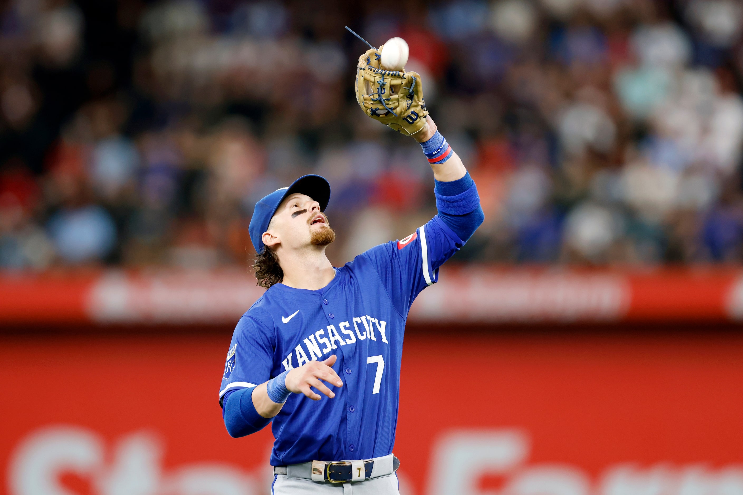 Kansas City Royals shortstop Bobby Witt Jr. (7) catches a fly ball from Texas Rangers...