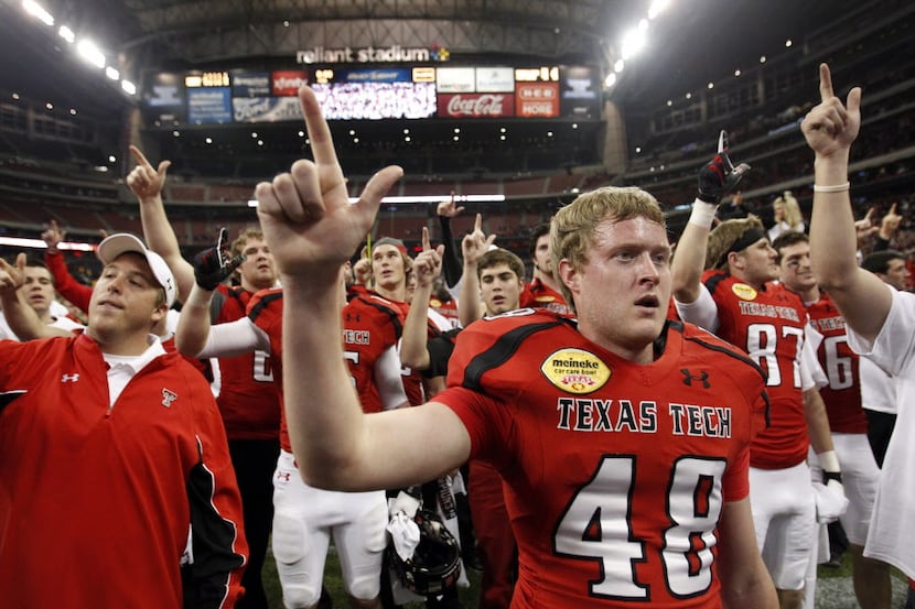 Texas Tech Red Raiders kicker Ryan Bustin (48) celebrates with his team after hitting the...