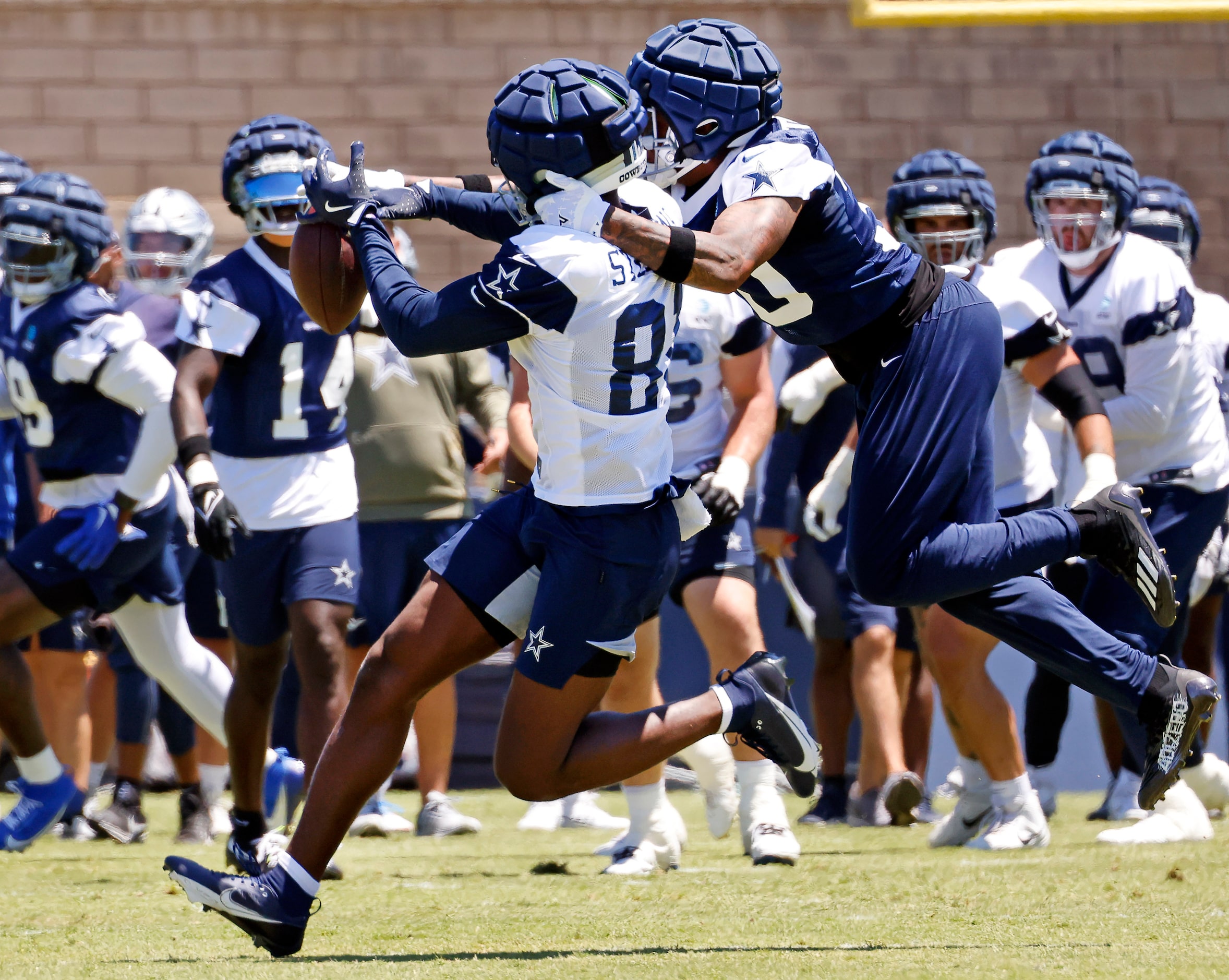 Dallas Cowboys tight end John Stephens (81) can’t hold onto a pass as he’s defended by...