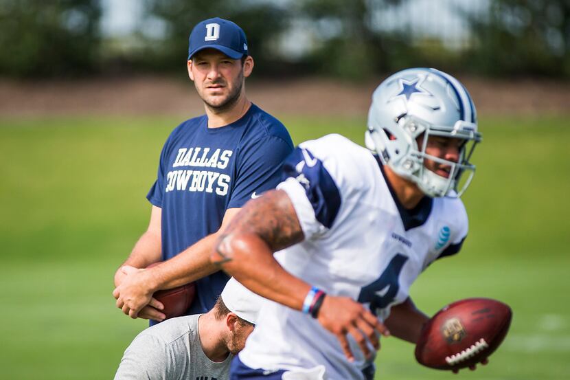 Dallas Cowboys quarterback Tony Romo watches quarterback Dak Prescott (4) on the field...