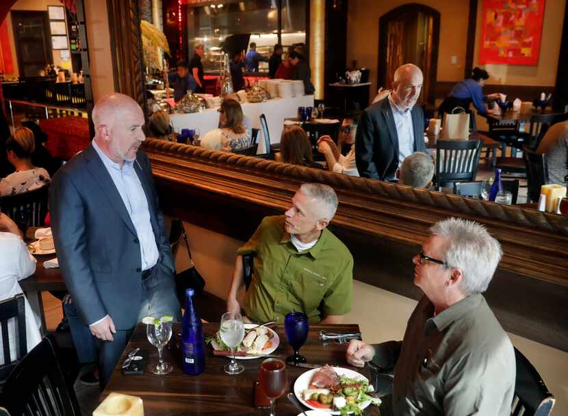 Texas de Brazil founder and owner Salim Asrawi visits with lunchtime patrons Dan Carroll...