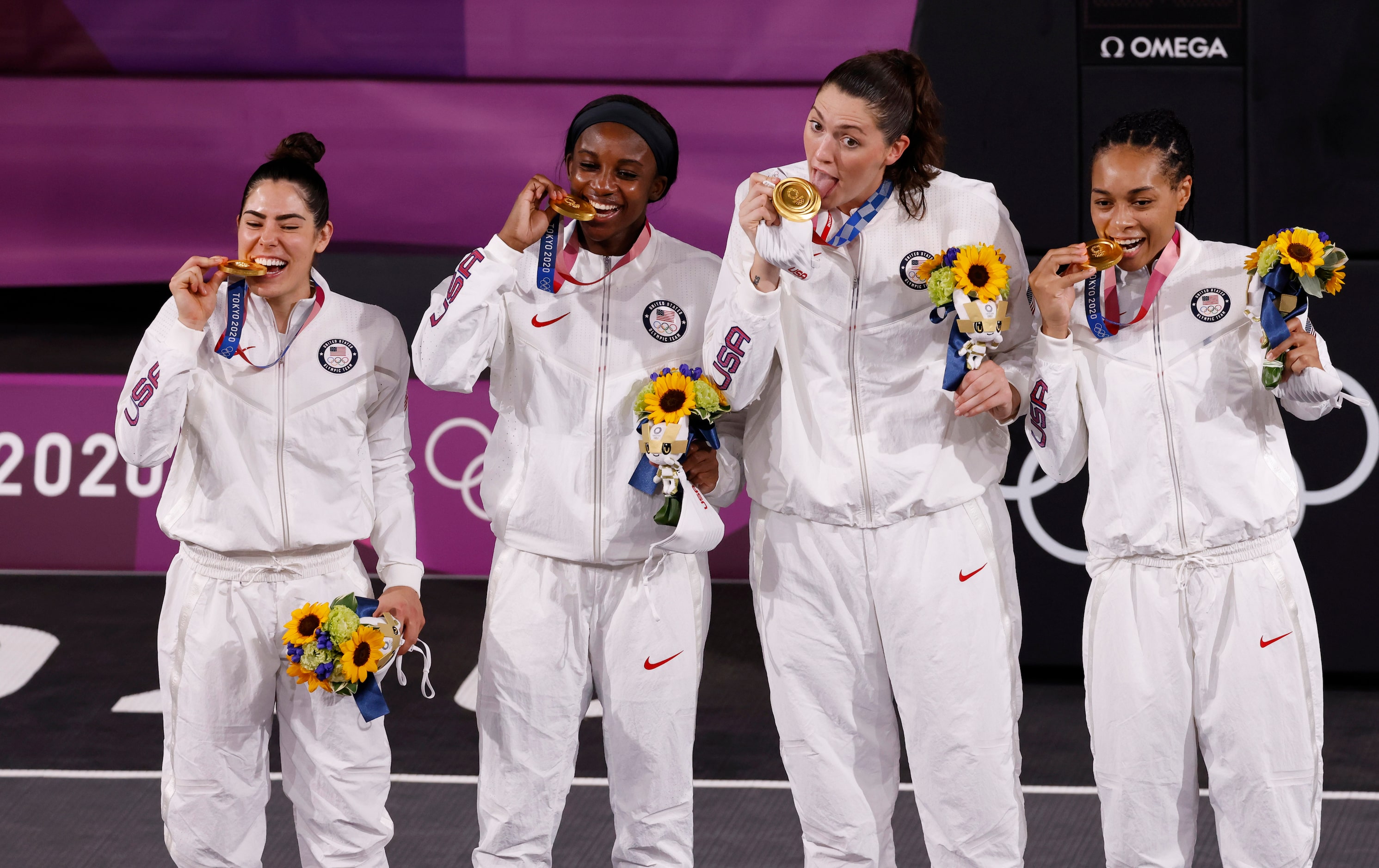 USA’s Kelsey Plum (5), Jacquelyn Young (8), Stefanie Dolson (13), and Allisha Gray (15) pose...