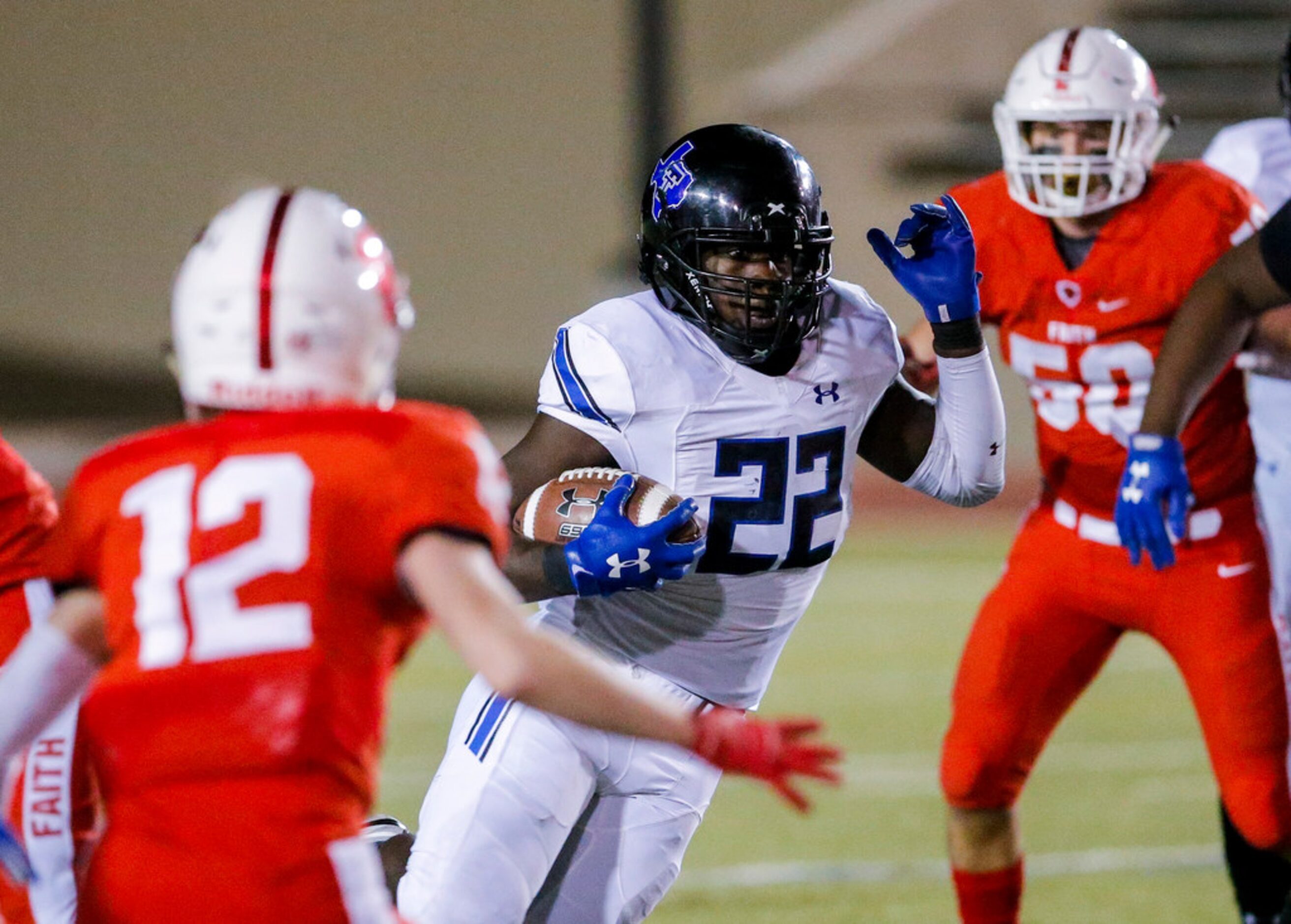 TXHSFB Trinity Christian Cedar Hill senior running back Ja'marvin Hartfield (22) carries the...