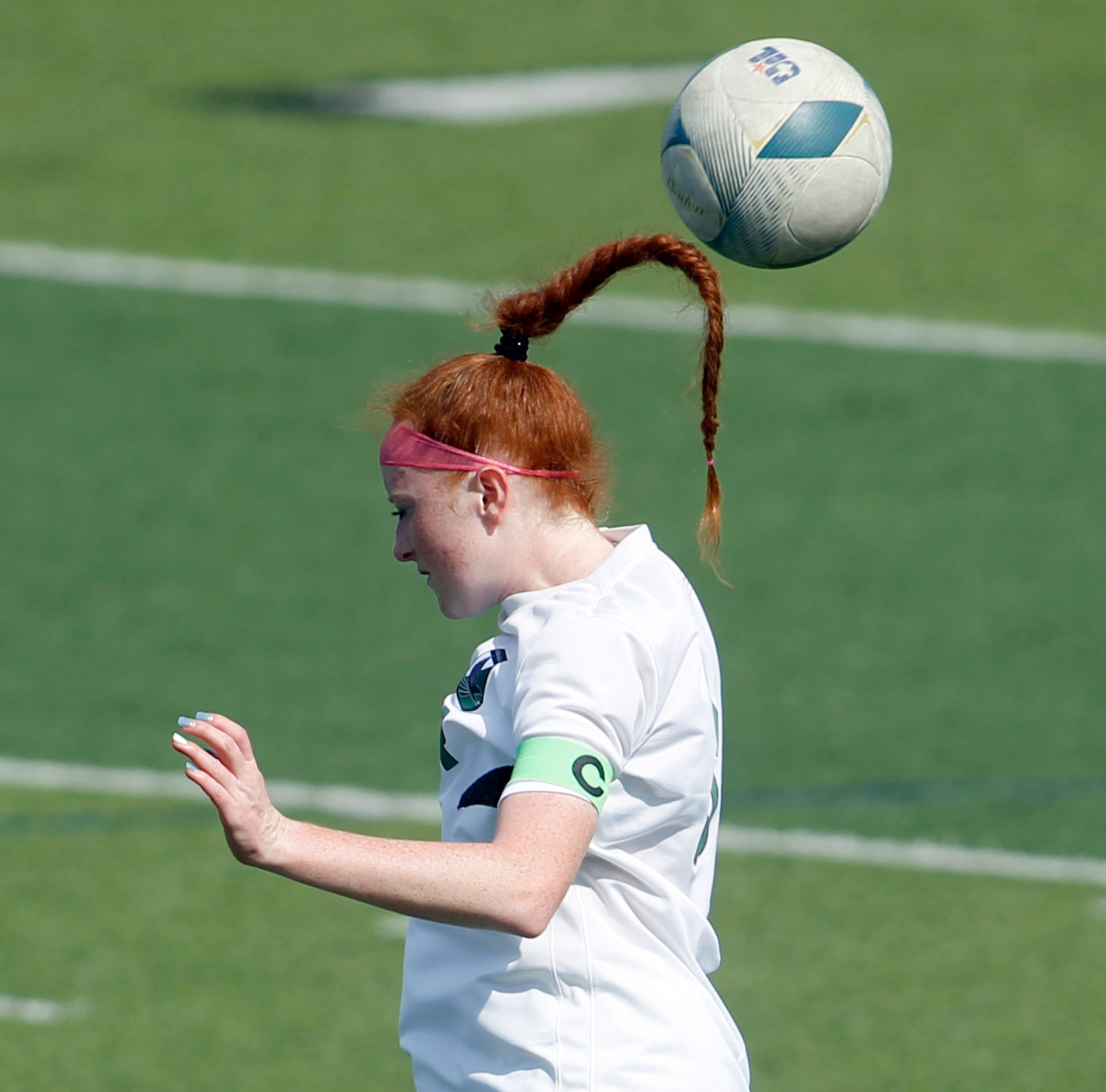  Prosper midfielder Olivia Hess (8) heads the ball to a teammate during the first half of...