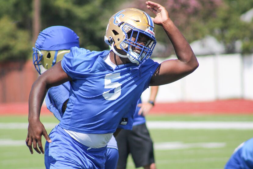 Garland Lakeview Centennial defensive lineman Trey Wilson practices his swim move. Wilson, a...