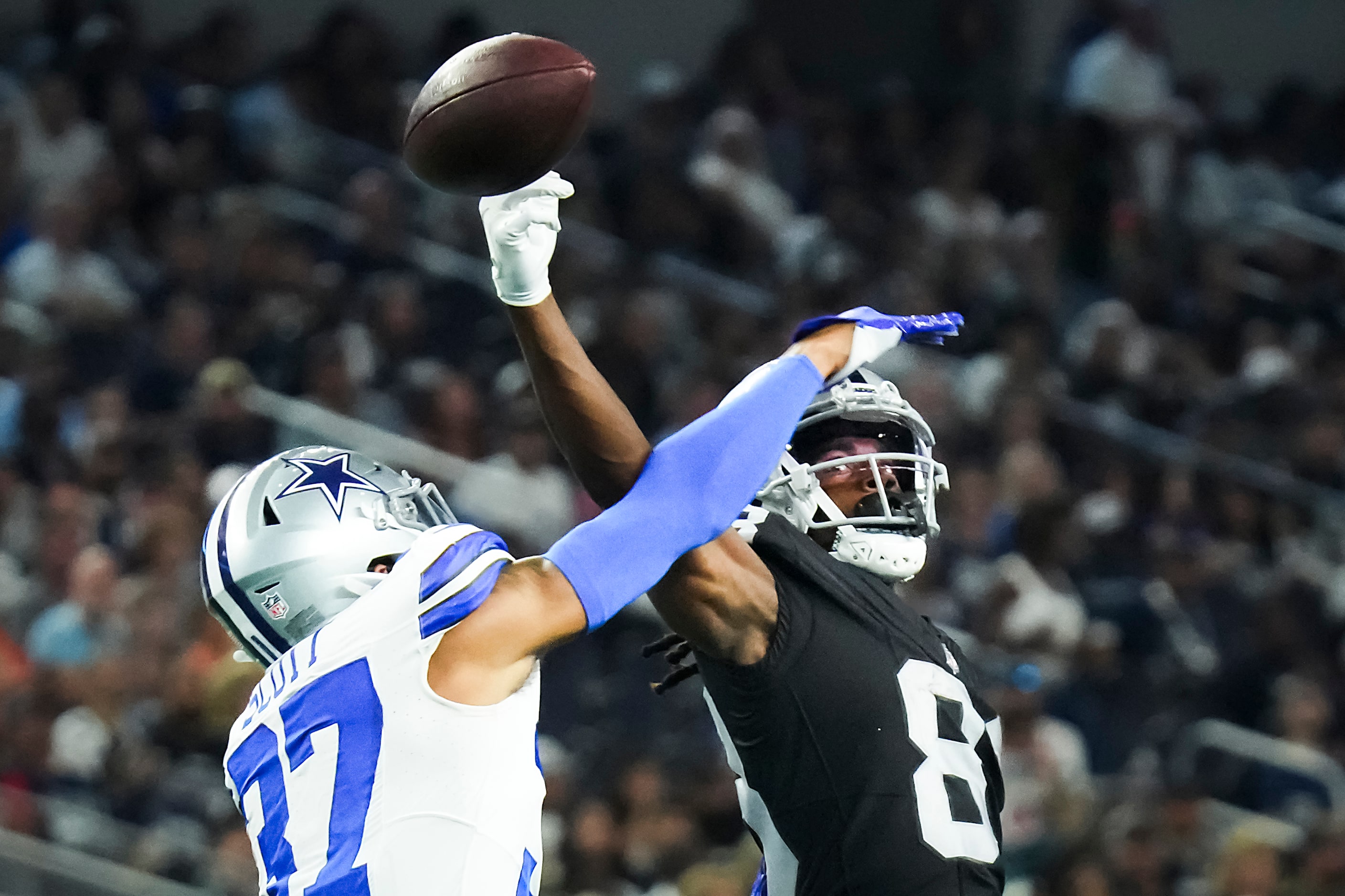 Dallas Cowboys cornerback Eric Scott Jr. (37) breaks up a pass intended for Las Vegas...