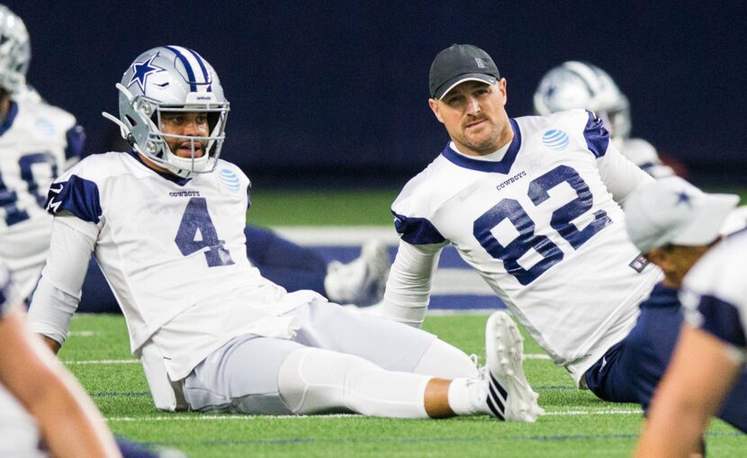 Dallas Cowboys quarterback Dak Prescott (4) and tight end Jason Witten (82) stretch during a...