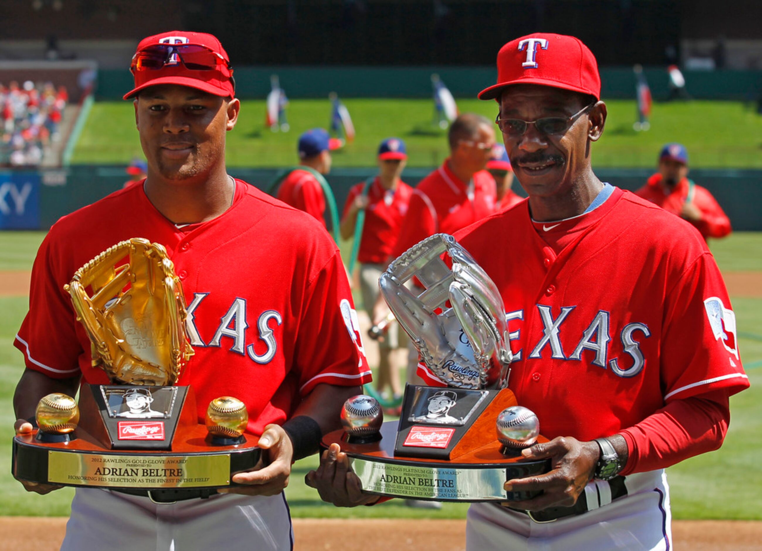 Texas Ranger player Adrian Beltre and Manager Ron Washingon hold the 2012 Gold and Platinum...