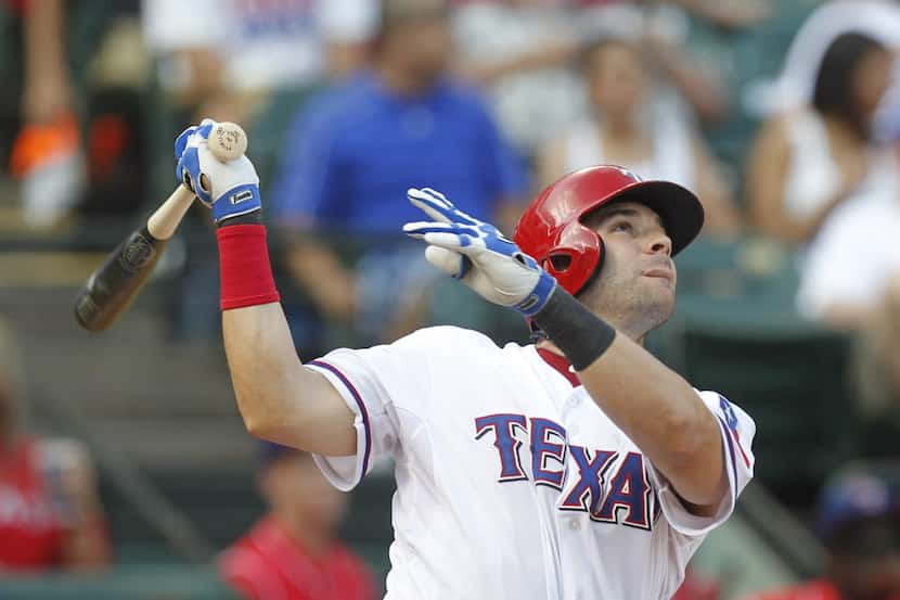 Texas Rangers first baseman Mitch Moreland (18) watches his 3rd inning solo home run against...