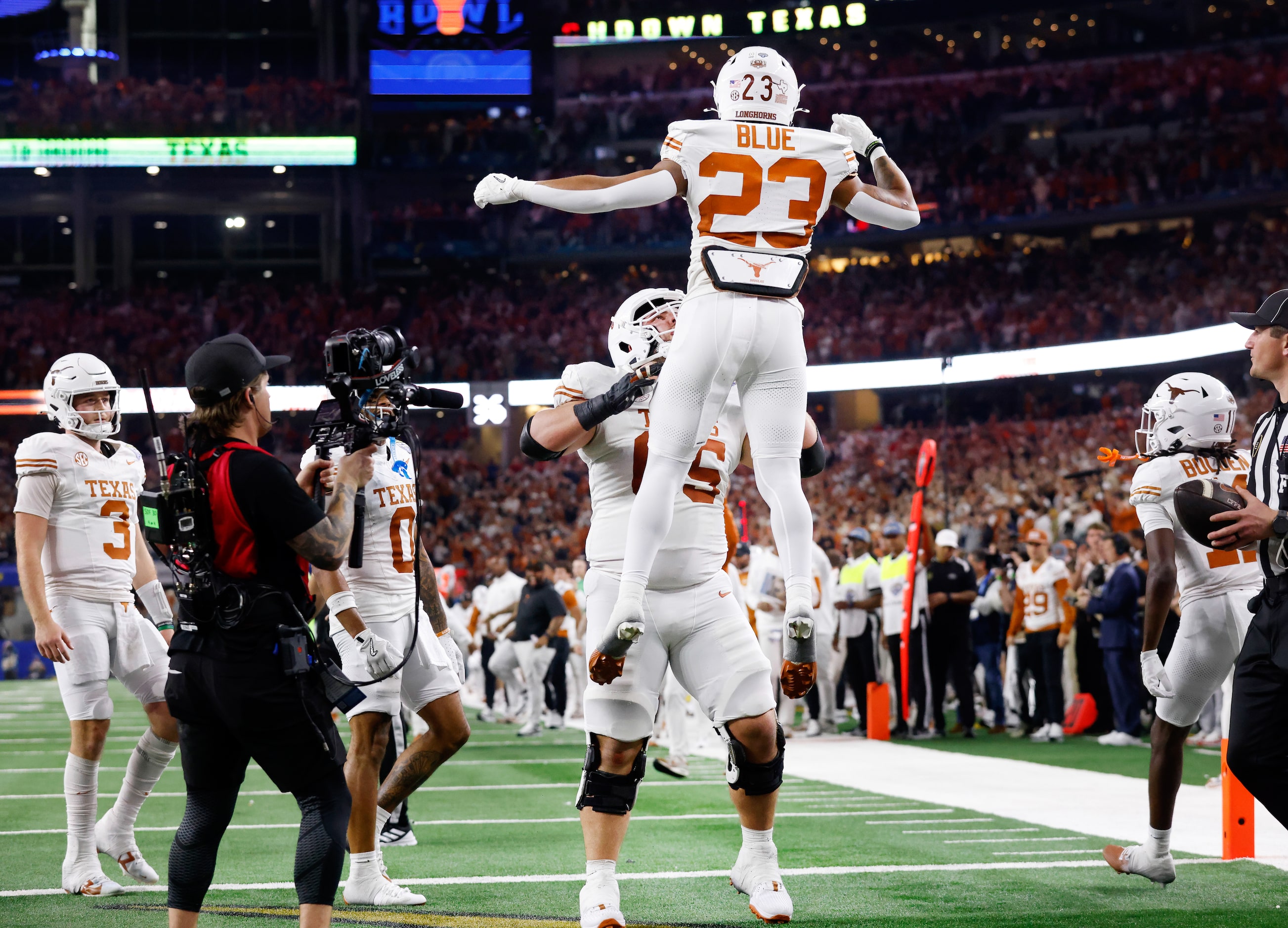 Texas Longhorns running back Jaydon Blue (23) is thrown in the air by offensive lineman Jake...