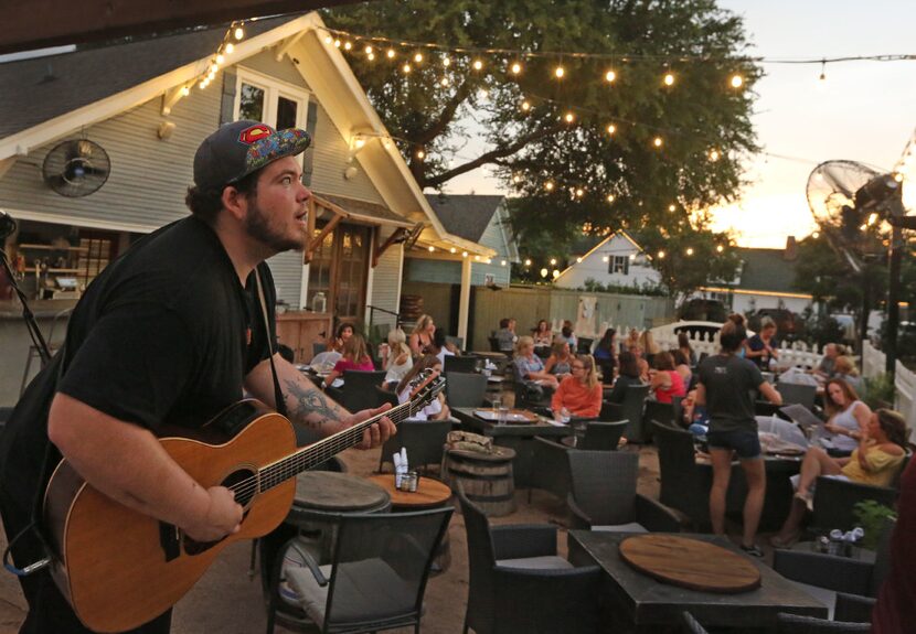 Clay Shelburn performs in the backyard of homey wine bar Eight11 Place.