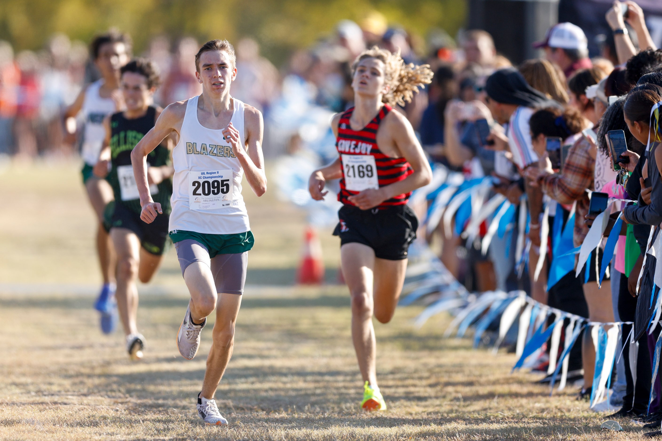 Frisco Lebanon Trail’s Andrew Malan (2095) sprints to the finish ahead of Lucas Lovejoy’s...