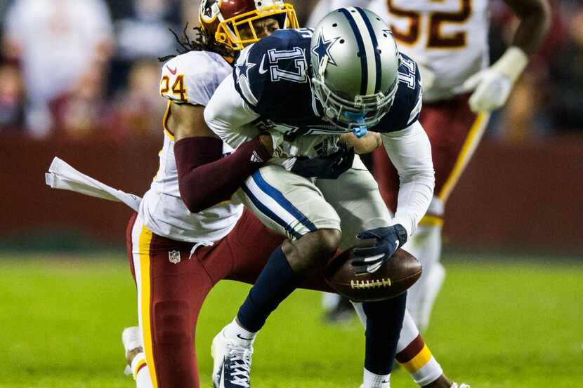 Dallas Cowboys wide receiver Allen Hurns (17) loses control of the ball as he's tackled by...