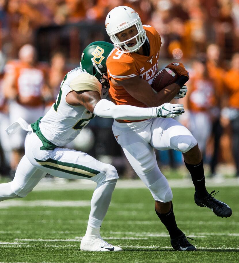 Texas Longhorns wide receiver Collin Johnson (9) is tackled by Baylor Bears cornerback...