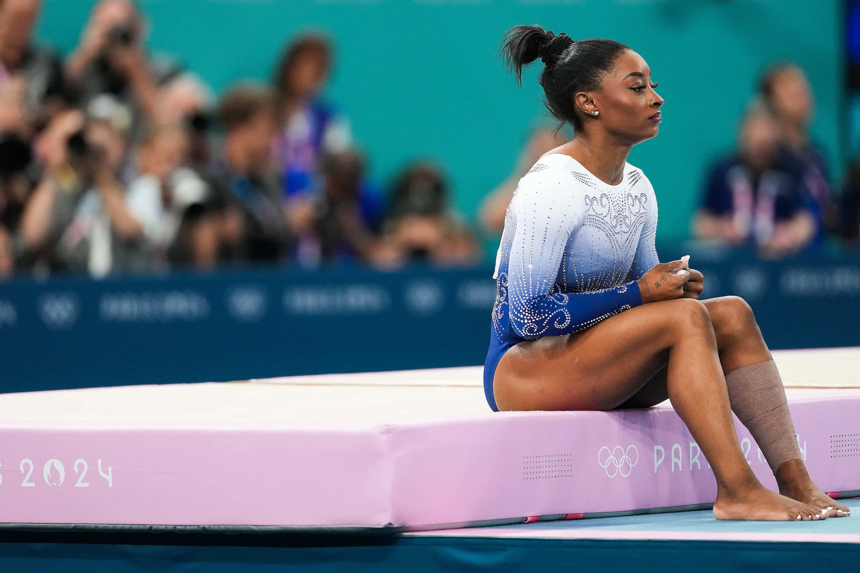 Simone Biles of the United States waits to compete on the balance beam during the women’s...