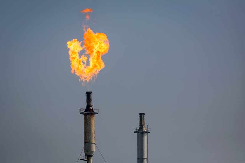  A flare burns over a Exxon Mobil Corp. refinery.