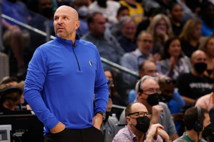 Dallas Mavericks head coach Jason Kidd looks up in between plays in a game against the Los...