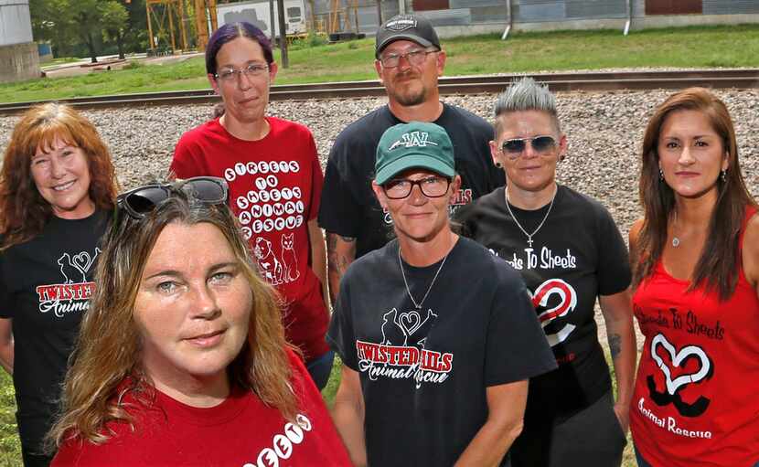 Mysti Boehler (second from left), the leader of Streets to Sheets, poses with members of her...