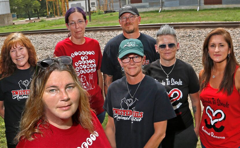 Mysti Boehler (second from left), the leader of Streets to Sheets, poses with members of her...