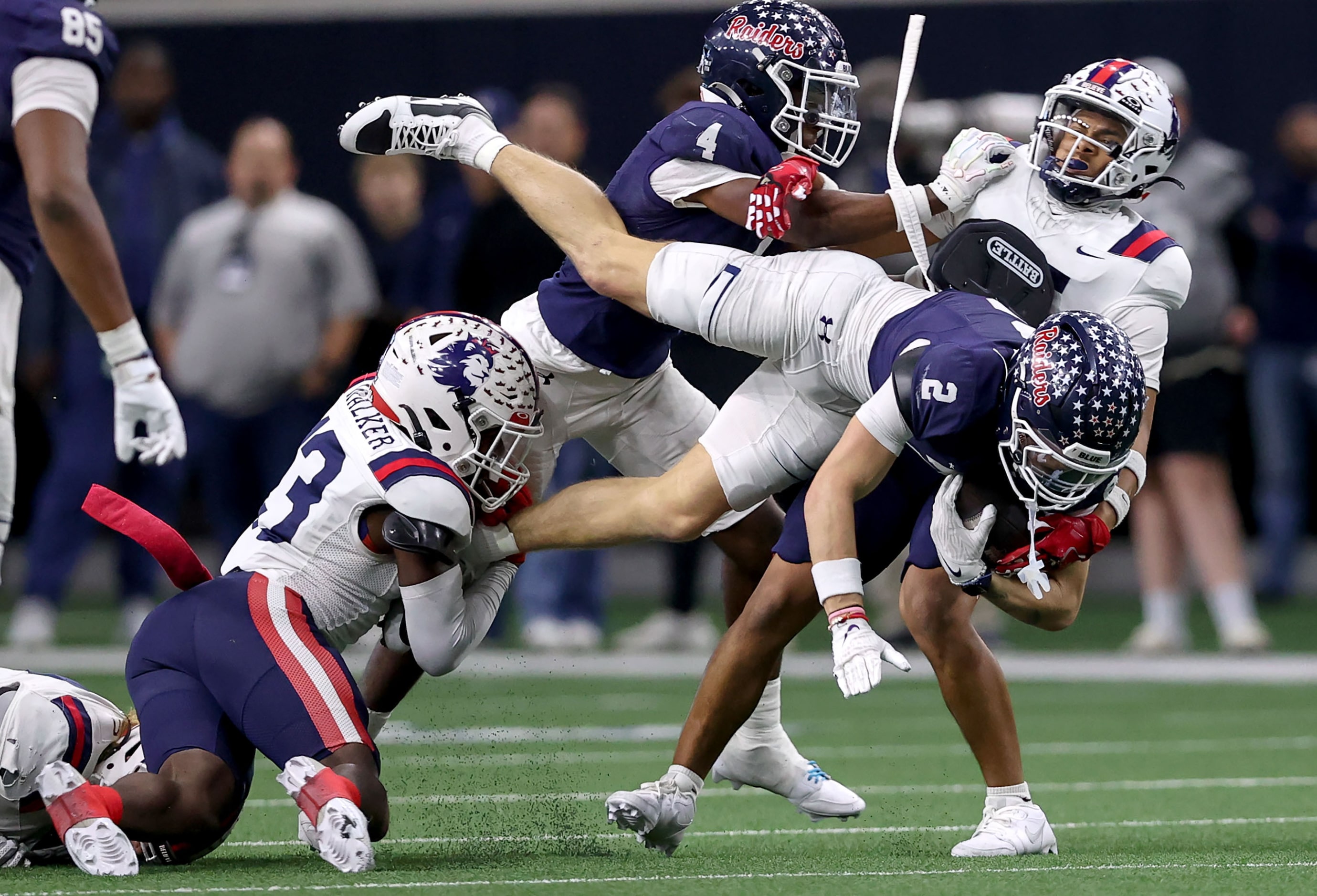 Denton Ryan wide receiver Braeden Mussett (2) is stopped by Richland defensive back Zeid...