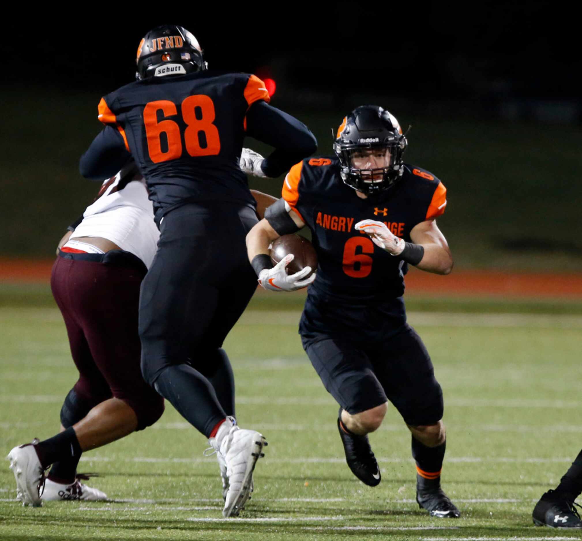 Rockwall RB Zach Henry (6) finds a hole and runs for a first down during the first half of...
