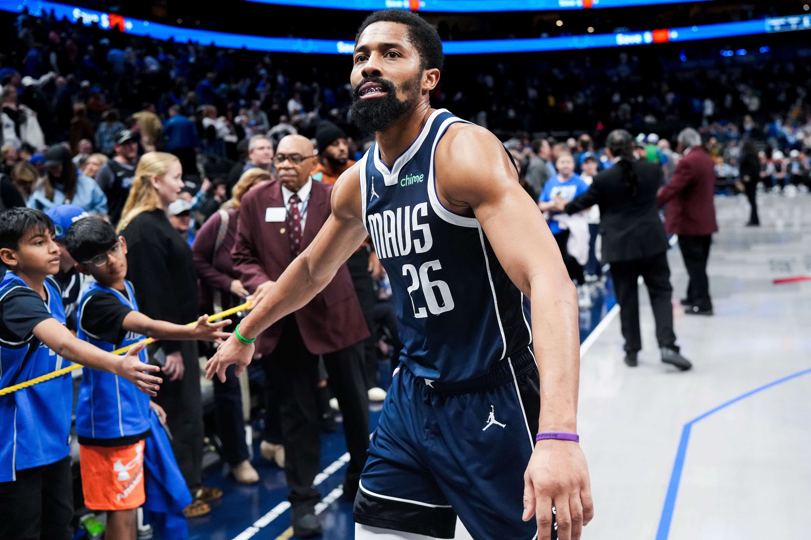 Dallas Mavericks guard Spencer Dinwiddie  walks off the court after a loss to the Denver...