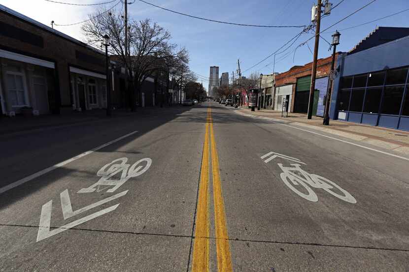 Symbols demarcate bike lanes to and from downtown along Main Street Monday, January 14, 2013...