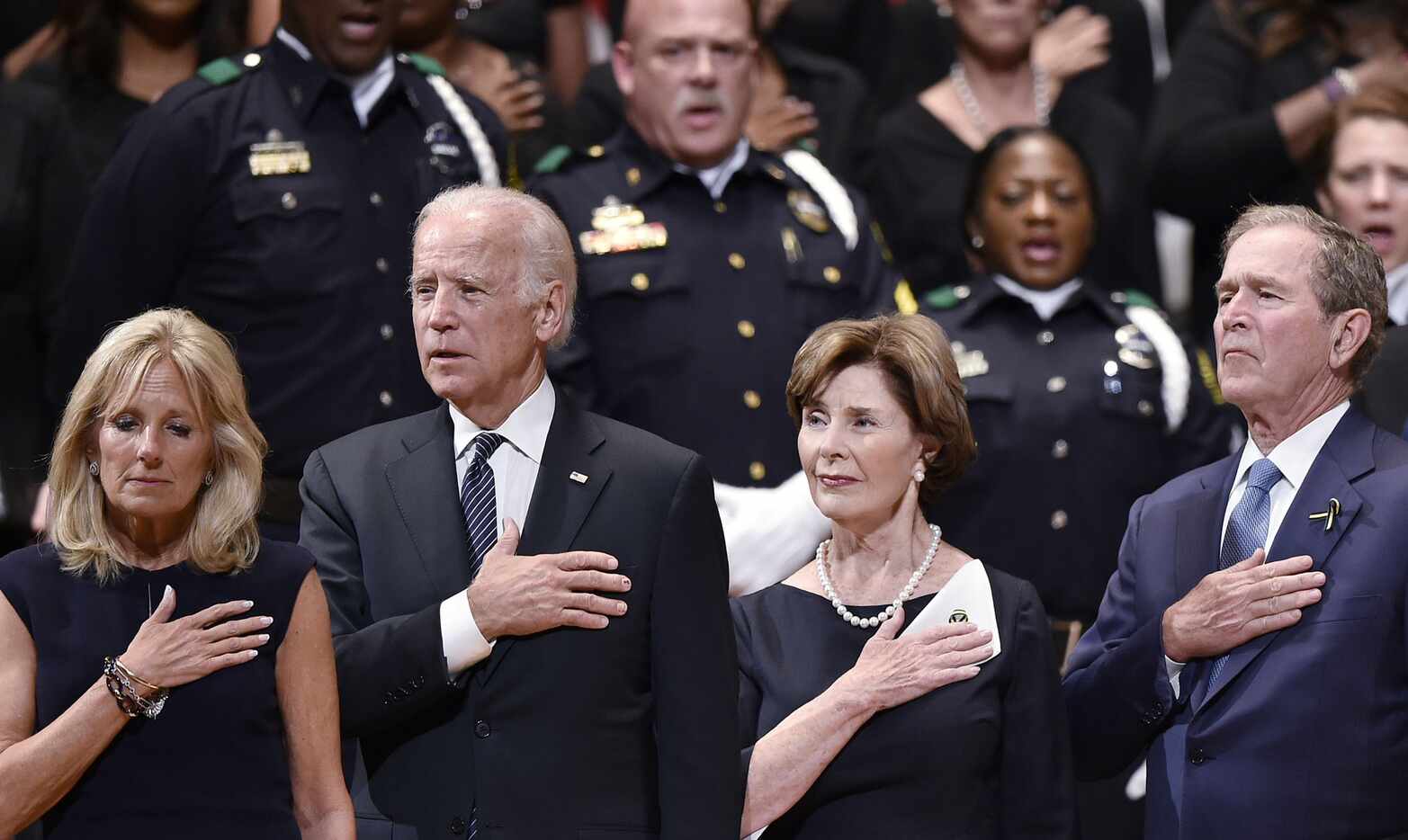 Sgt. James Bristo (top row, middle) sang at the interfaith memorial Tuesday at the Meyerson...