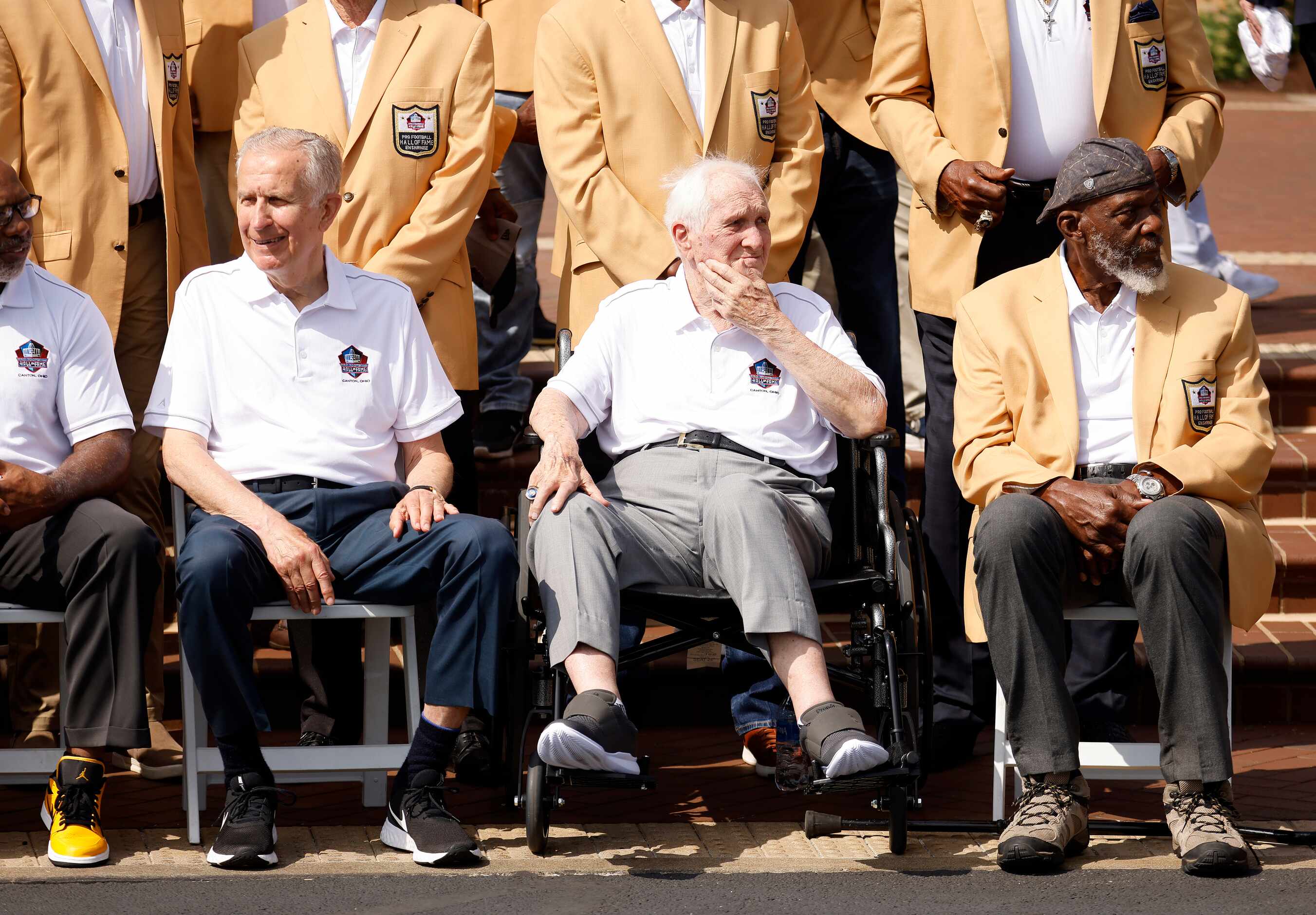 Dallas Cowboys Pro Football Hall of Fame member Gil Brandt (second from right) waits with...