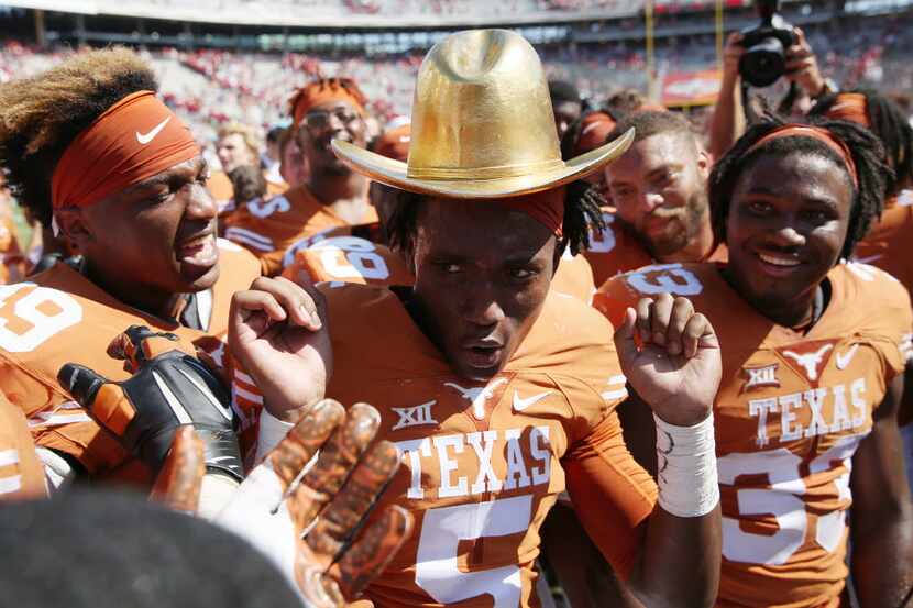 FILE - Texas Longhorns defensive back Holton Hill (5) dances with the Golden Hat after...