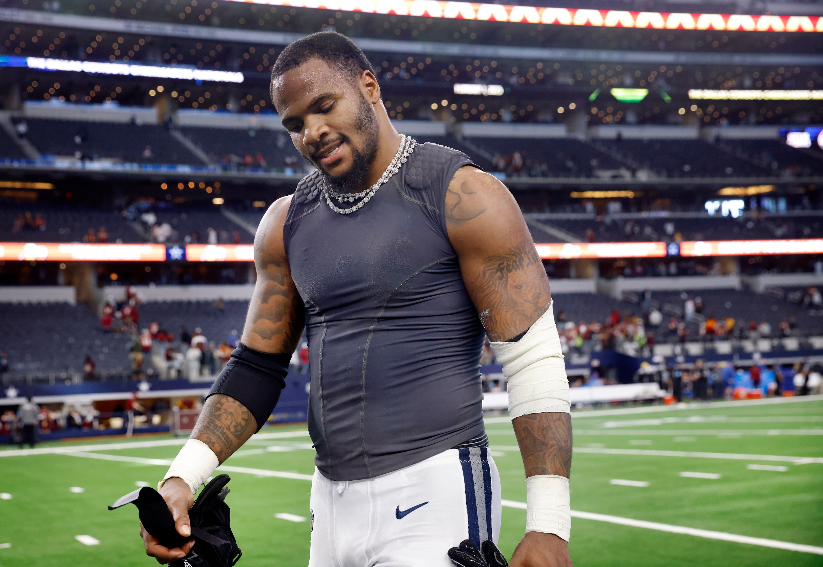 Dallas Cowboys linebacker Micah Parsons walks to the locker room following their...