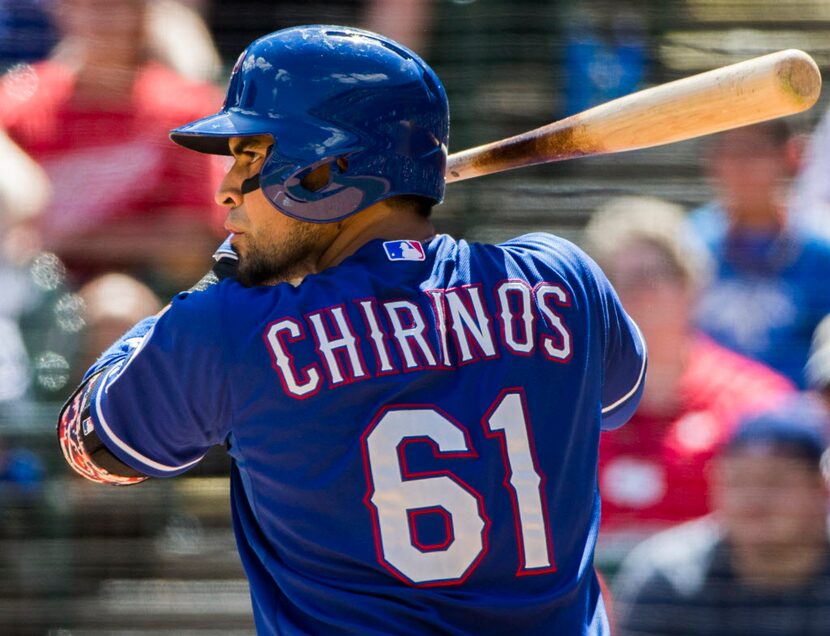 Texas Rangers catcher Robinson Chirinos (61) bats during the ninth inning at their game on...