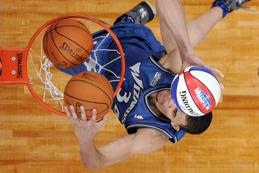 Washington Wizards' JaVale McGee dunks during the Slam Dunk Contest at the NBA basketball...